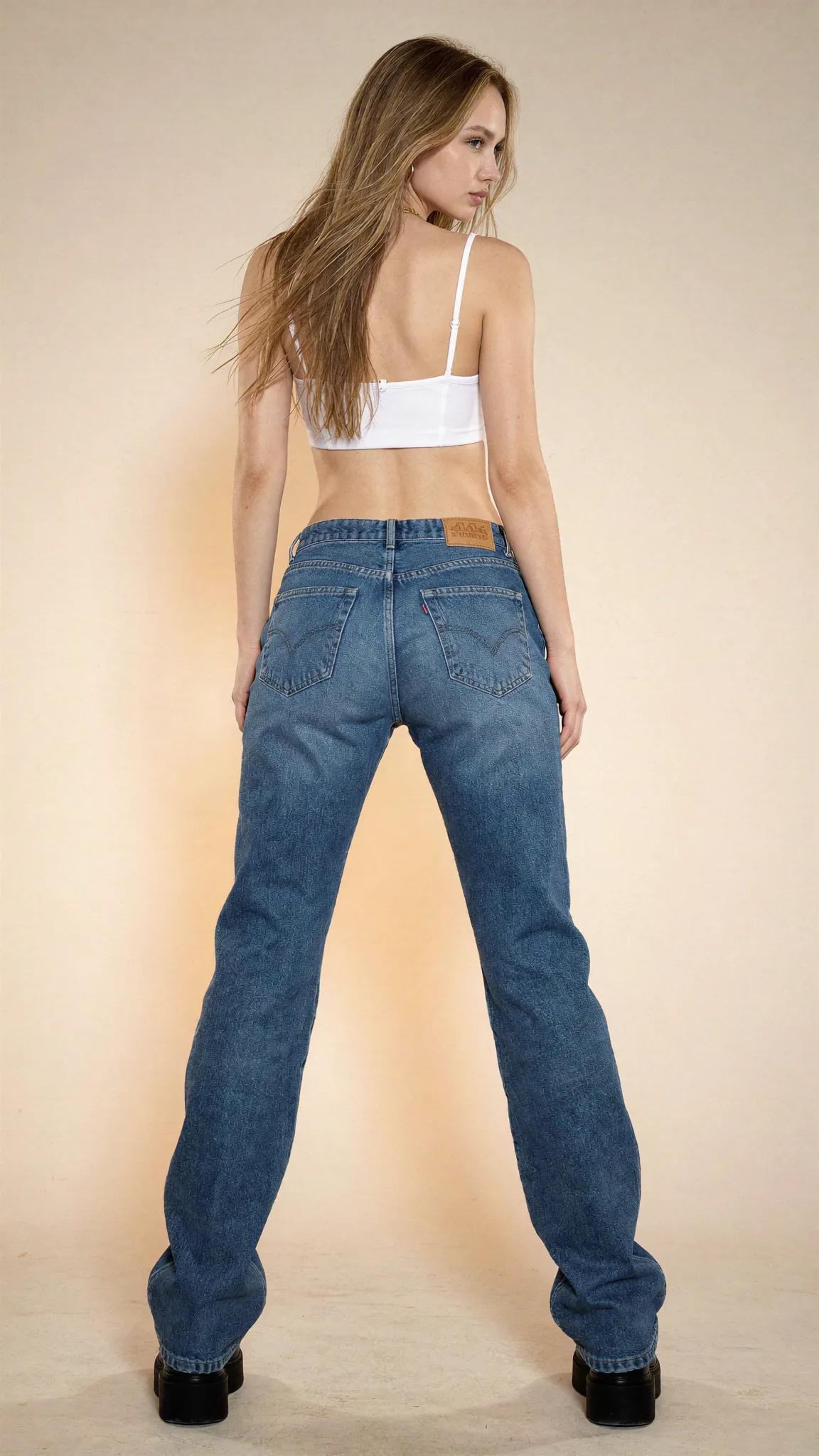 Synthetic fashion creator in wide-leg denim against a warm studio backdrop