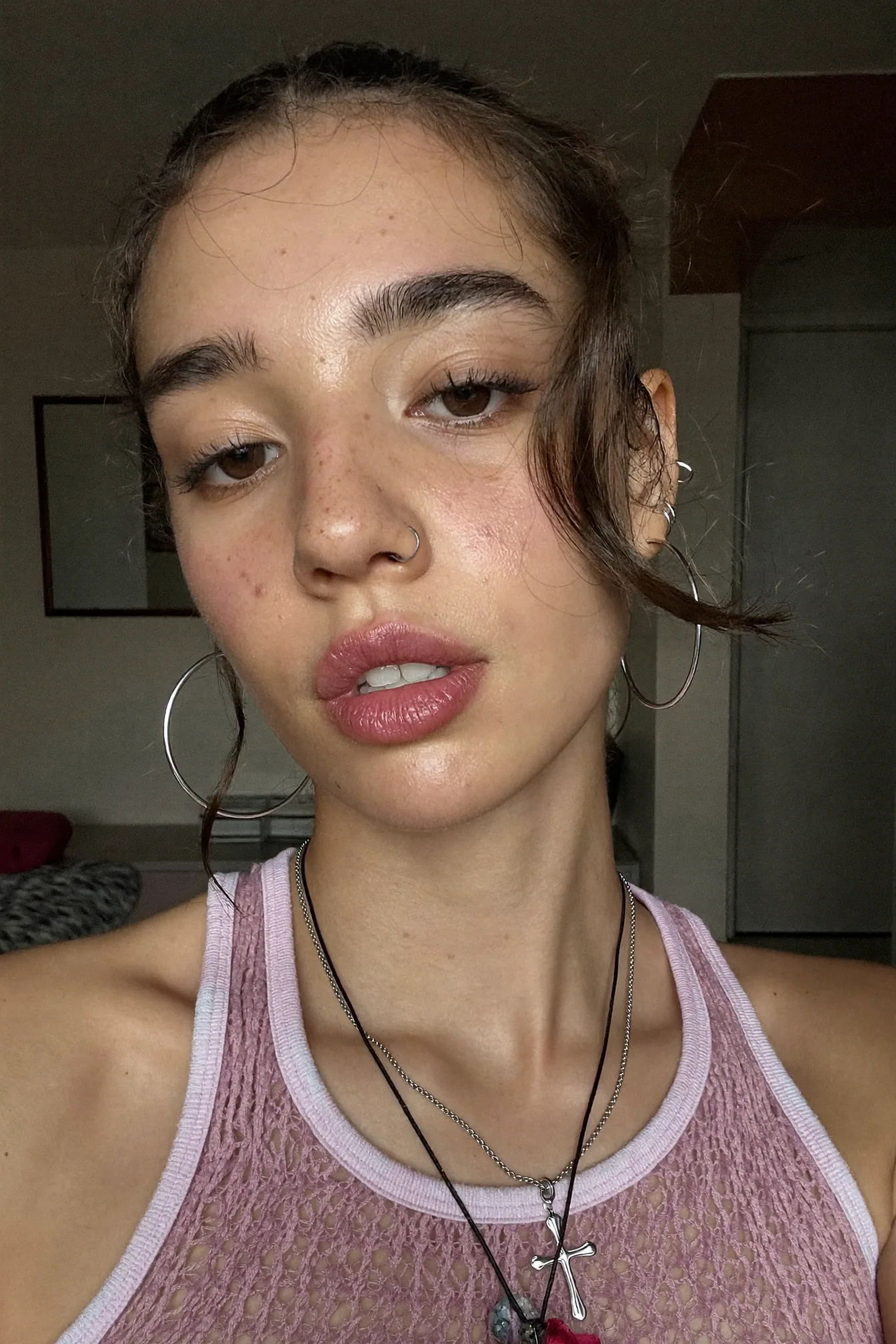 Close-up creator selfie in a textured pink sport top