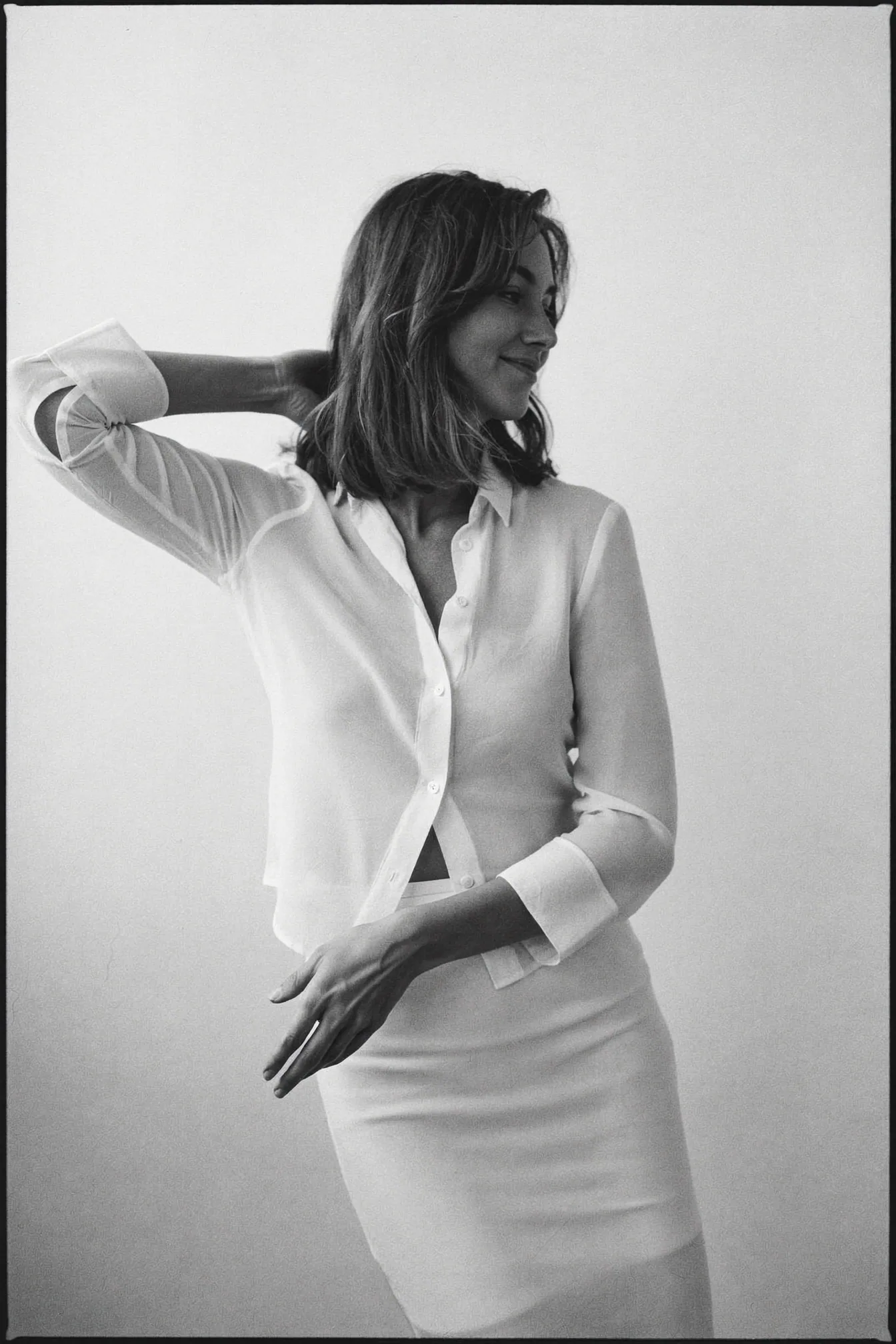 Monochrome fashion study in crisp white tailoring