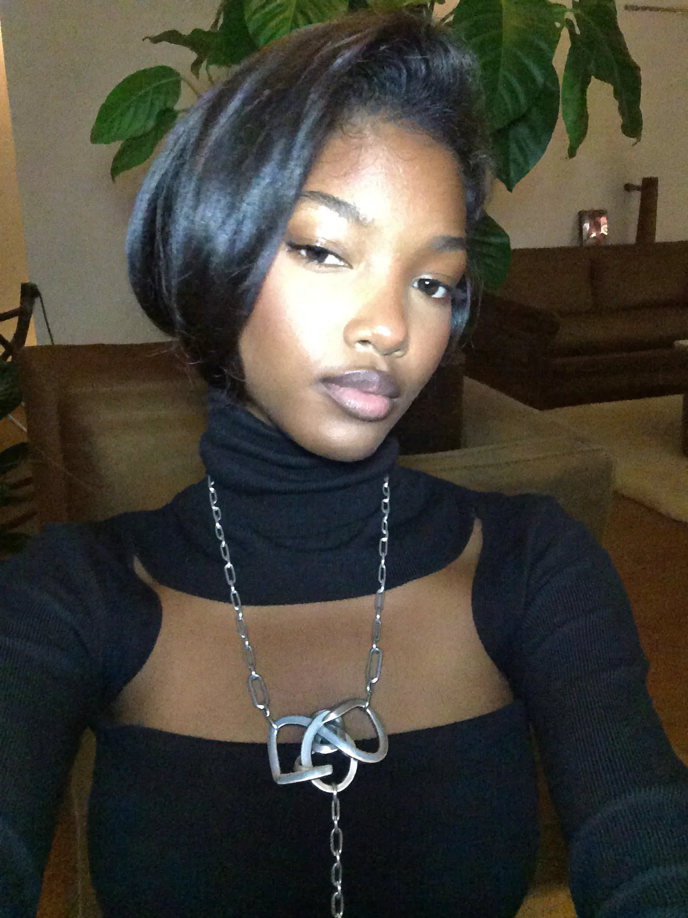 Night selfie in a black logo top with flash highlights