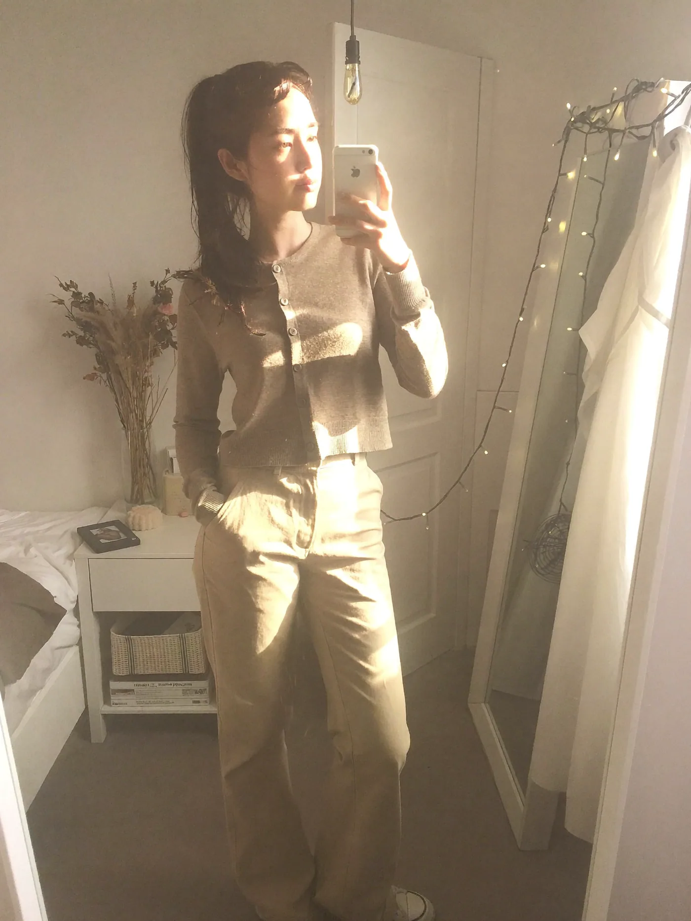 Soft sunlit bedroom fashion selfie