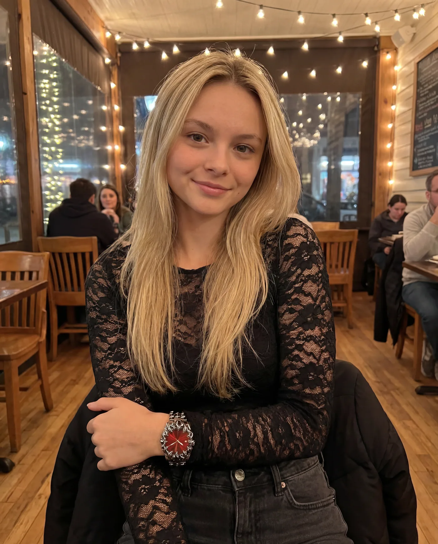 Lifestyle campaign image featuring a red watch in a restaurant